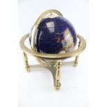 A Lapis Globe mounted with mineral and semi-precious stones.