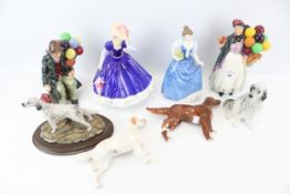 A collection of eight assorted ornamental figurines.