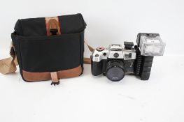 An Olympia DL2000A camera and bag