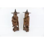 A pair of 20th century Chinese wood carved figures.