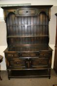 A vintage stained oak break front dresser.