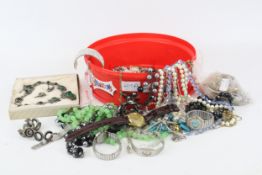 A group of assorted vintage costume jewellery. Including a green-set necklace, watches, etc.