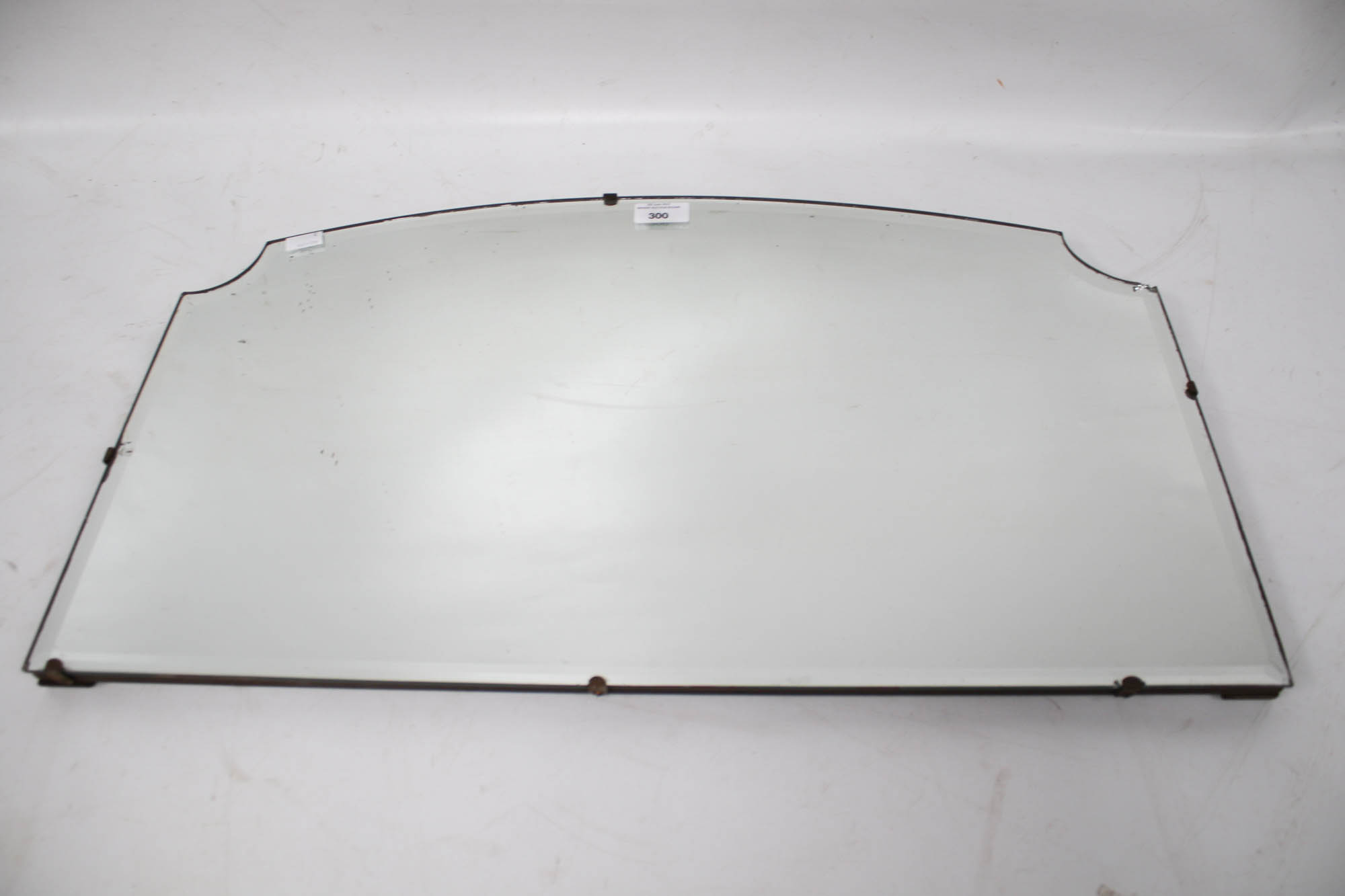 A vintage bevel edge wall mirror.