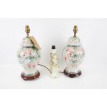 A pair of 20th century lamp bases and a Meissen style lamp base.