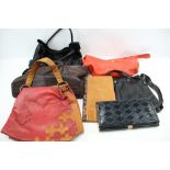 An assortment of vintage ladies handbags.