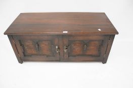 An early 20th century oak stained walnut low Cabinet.