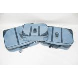 Three Antler blue leatherette suitcases.