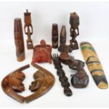 A collection of assorted carved African tribal items. Including ornaments, masks, etc. Max.