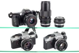 A group of Olympus cameras and lenses. To include two Olympus OM10 cameras each with 50mm f1.