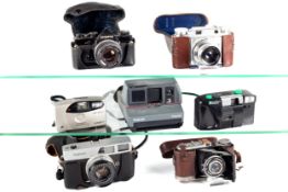 Seven film cameras. To include a Voigtlander Prominent rangefinder with a 50mm f3.