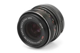 A Carl Zeiss Jena DDR 35mm 1:2.4 MC Flektogon lens. M42 mount with rear cap only.