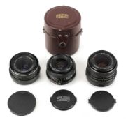 Three M42 mount Carl Zeiss Jena lenses. To include a 28mm f2.8 MC lens, a 35mm f2.