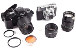 An assortment of camera items to include A Kodak Retinette I B camera with a Prontor 500LK lens,