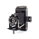 A Kodak 620 Art Deco folding bellows camera. With a 10.5cm f6.3 Anastigmat lens, and leather case.