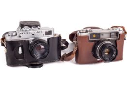 Two 35mm rangefinder cameras.