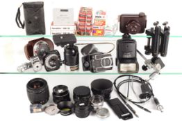 An assortment of camera lenses and accessories.