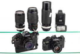 A Canon 35mm SLR camera outfit. Consisting of a Canon A1 with power winder and a 50mm f1.