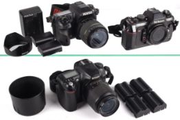 An assortment of cameras to include Pentax K-7 with a Pentax 18-55mm lens, A Nikon F-501,