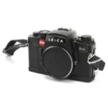 A Leica R4 35mm SLR camera body, black. Serial Number 1609947.