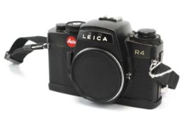A Leica R4 35mm SLR camera body, black. Serial Number 1609947.