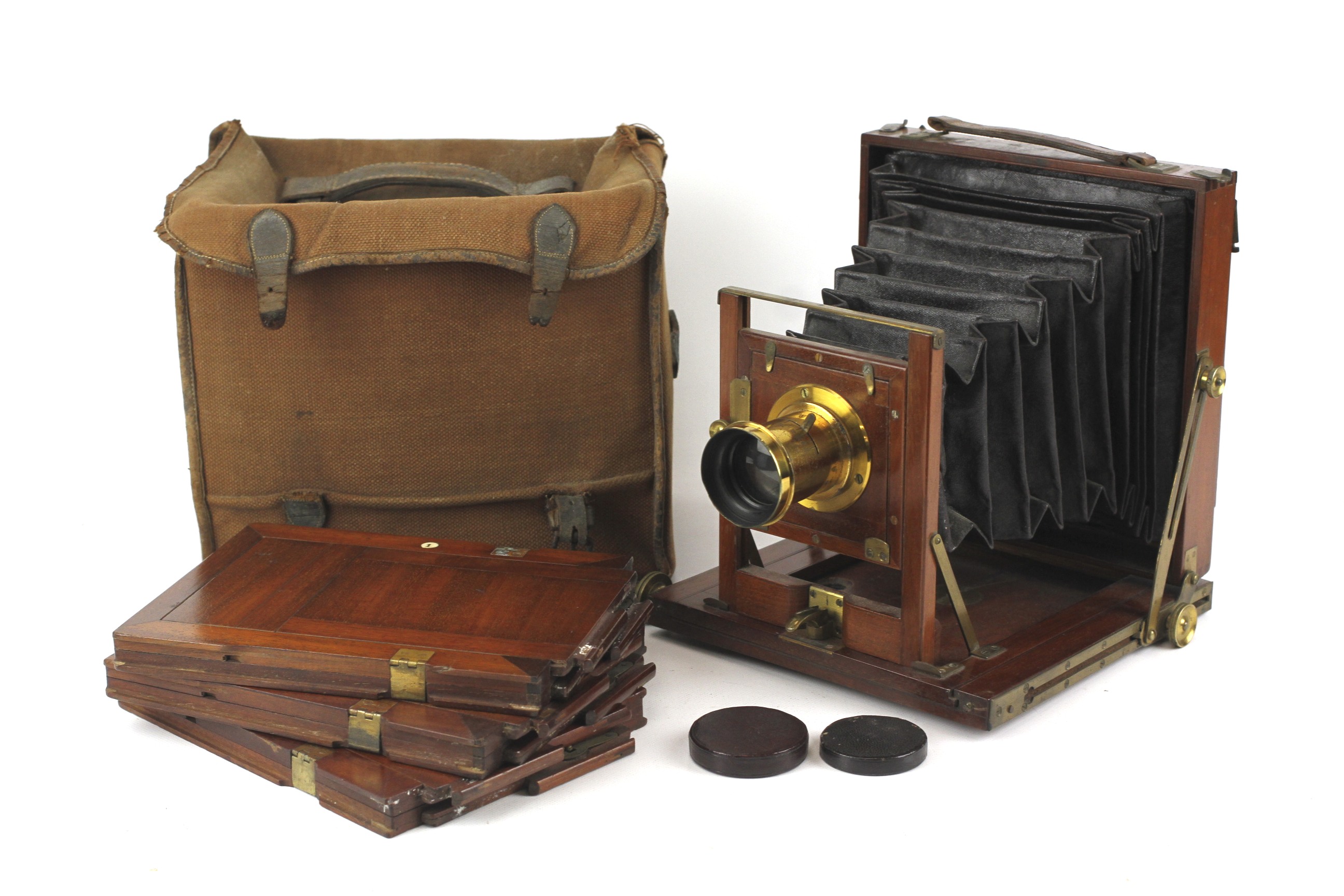 An unbranded mahogany and brass antique large format plate camera.