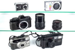 A collection of assorted Pentax cameras and lens. Including a P30n s/n.