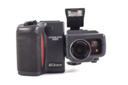 A Nikon coolpix 995 3.34 mega pixels camera in leather carry case.