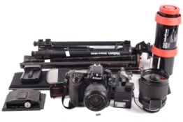 An assortment of cameras to include A Velbon tripod, sigma mirror-telephoto1:8 f=600mm zoom,