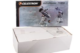 A Celestron Astro Master 114EQ Newtonian reflector telescope boxed