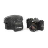 A Mamiya ZE 35mm SLR camera. With a Mamiya-Sekor E 50mm 1:1.7 lens and ever ready case.