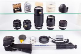 A collection of camera accessories. To include a Hoya 28mm f2.8 lens and a Hoya 135mm f2.