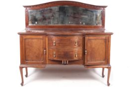A early 20th century mirror backed bow-fronted sideboard.