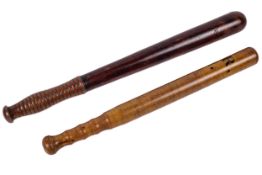 Two Victorian turned wooden truncheons.