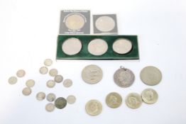 An assortment of coins, to include 3D coins, four £2 coins and other examples.