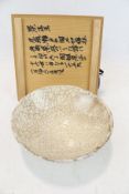 A Japanese part beige glazed studio bowl with dark craquelure. Mark to base.