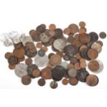 A tin of world coins including silver coins
