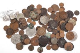 A tin of world coins including silver coins