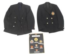 Military Insignia : Two blazers and a display of badges.