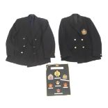 Military Insignia : Two blazers and a display of badges.