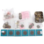 An assortment of coins to include Commemorative 50p coins, and other coinage.