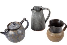 Three stoneware studio items, to include a teapot and two jugs.