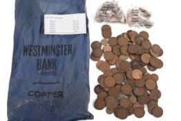 An old Westminster Bank bag with 20th century pennies and half pennies