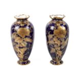 A pair of circa 1900 Royal Crown Derby vases.