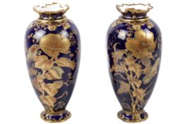 A pair of circa 1900 Royal Crown Derby vases.