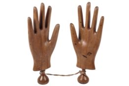 A pair of beech shop glove display/mannequin hands.