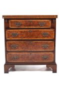 A 20th century George I style figured walnut bachelor's chest.