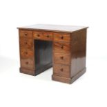 A circa 1900 mahogany pedestal desk.