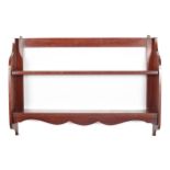 A late 18th century mahogany set of open hanging shelves.