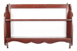 A late 18th century mahogany set of open hanging shelves.