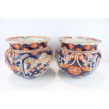 A pair of Chinese ribbon jardiniere in the Imari palette.
